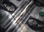 Dollar slips lower vs. rivals as Greece concerns subside