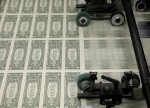 Dollar turns broadly lower in quiet trade