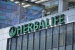 Herbalife cuts pay of CEO Johnson 36 percent after missed targets