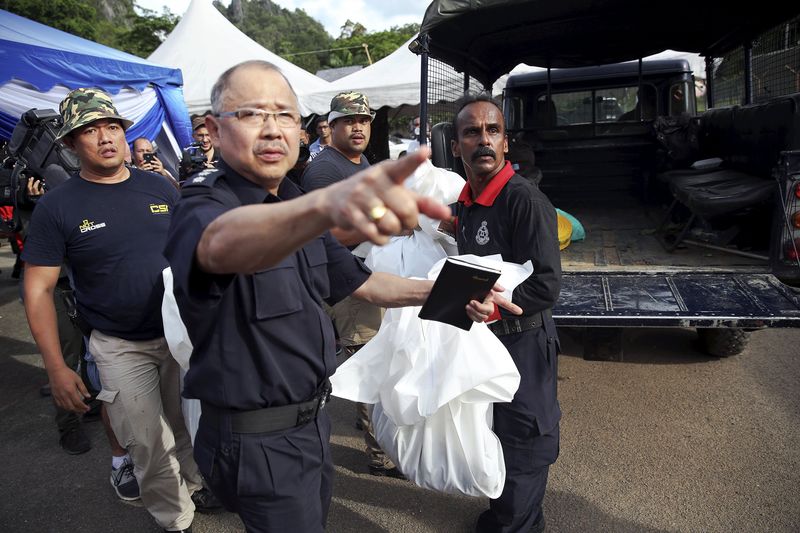 Malaysia finds 139 graves in cruel jungle trafficking camps By.
