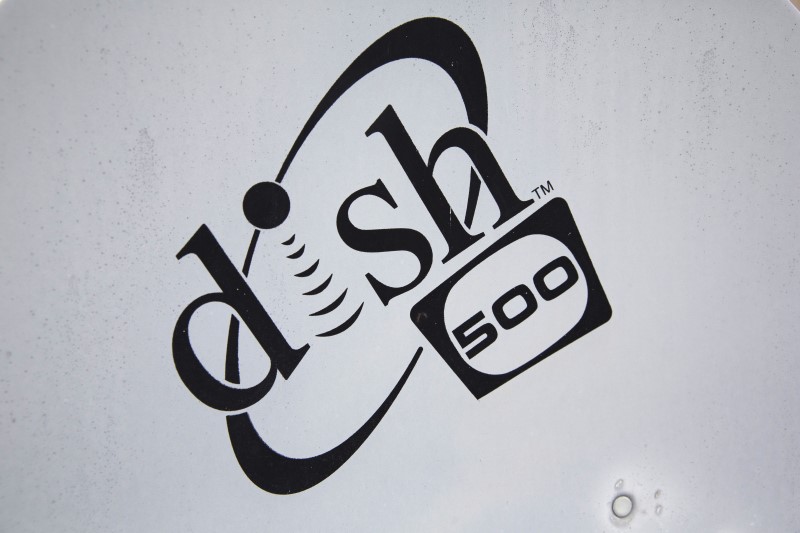 © Reuters. A Dish Network logo is seen on a satellite dish on a Brooklyn apartment building roof in New York