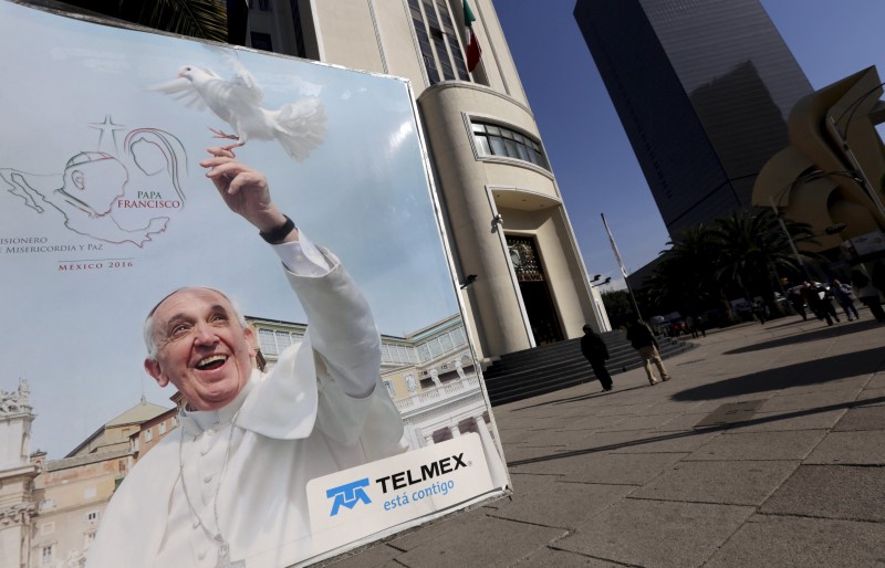© Reuters. An image of Pope Francis is seen on a phone booth before his visit to Mexico City